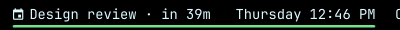The Omarchy bar showing 'Design review · in 39m' before the clock